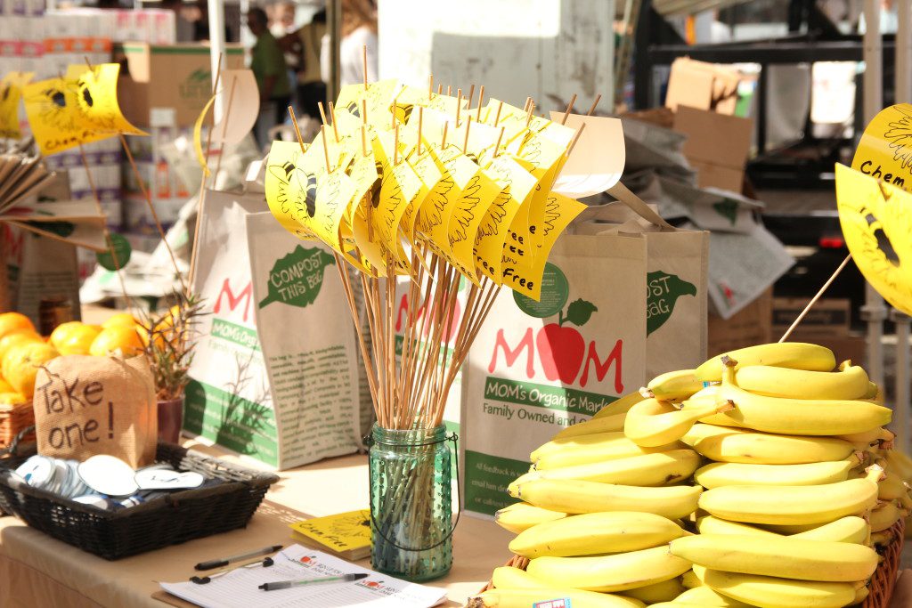 MOM's Organic Market gives out free organic produce and snacks at Greenfest. 
