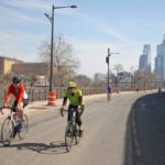 Cyclists and joggers use Martin Luther King Drive