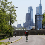 A bicyclist rides on Martin Luther King Drive on Friday, May 21, 2021.