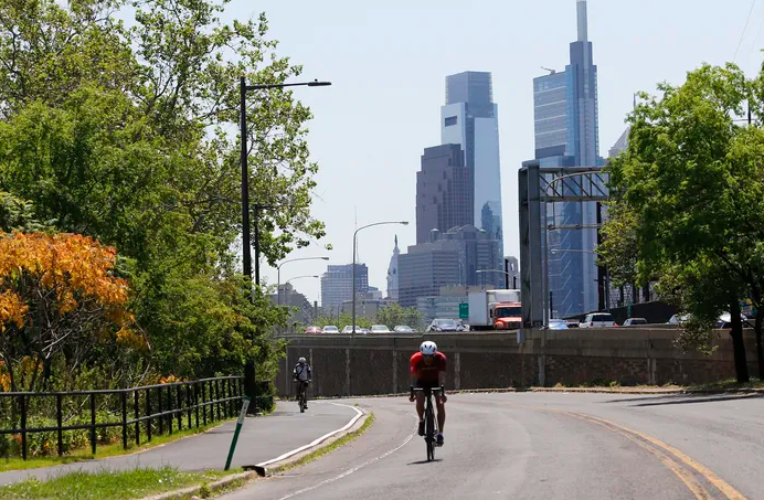 A bicyclist rides on Martin Luther King Drive on Friday, May 21, 2021.