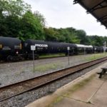 Freight train operated by Norfolk Southern rolls past the former train station in Phoenixville, Pa.