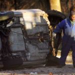 An overturned car on the Cobbs Creek Parkway