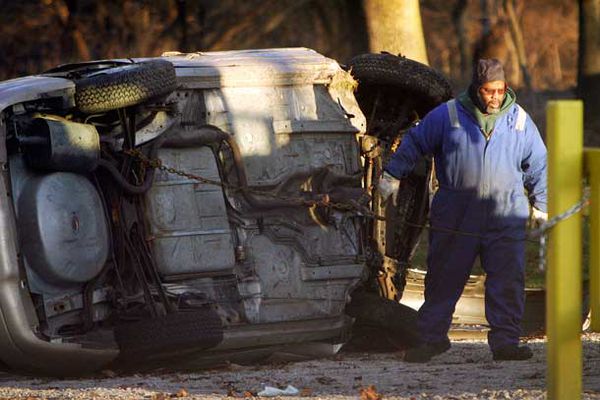 An overturned car on the Cobbs Creek Parkway