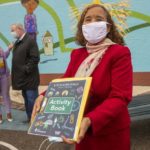 Deanda Logan, principal of William Cramp Elementary School, with the Safe Routes Philly Activity Book.