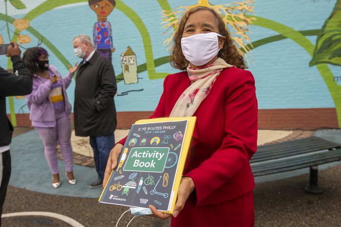 Deanda Logan, principal of William Cramp Elementary School, with the Safe Routes Philly Activity Book.