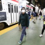 Volunteer Cameron Adamez looks around the SEPTA Trolley Line stop at the 15th Street Station as Camille Boggan, a research assistant at Penn's Center for Safe Mobility, takes notes.