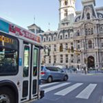 A SEPTA bus approaches City Hall in a bus lane.